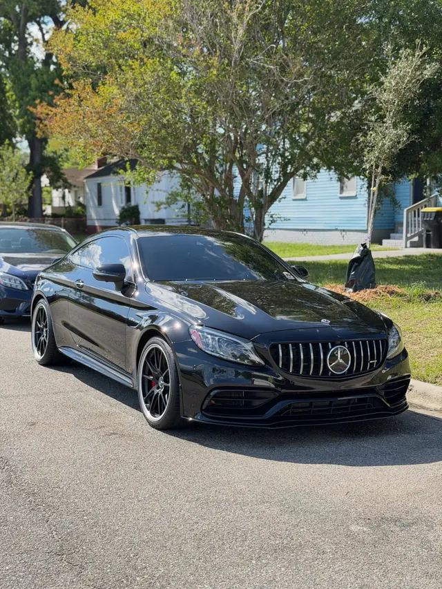 Black Mercedes-AMG coupe with a deep gloss finish