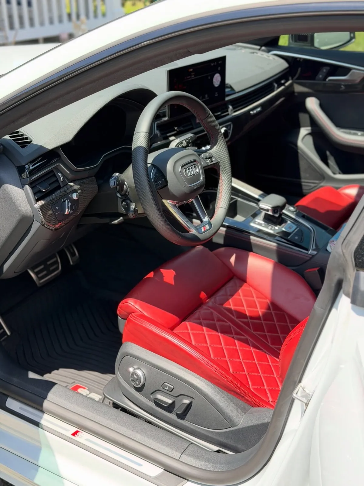 Red leather seats inside a detailed Audi