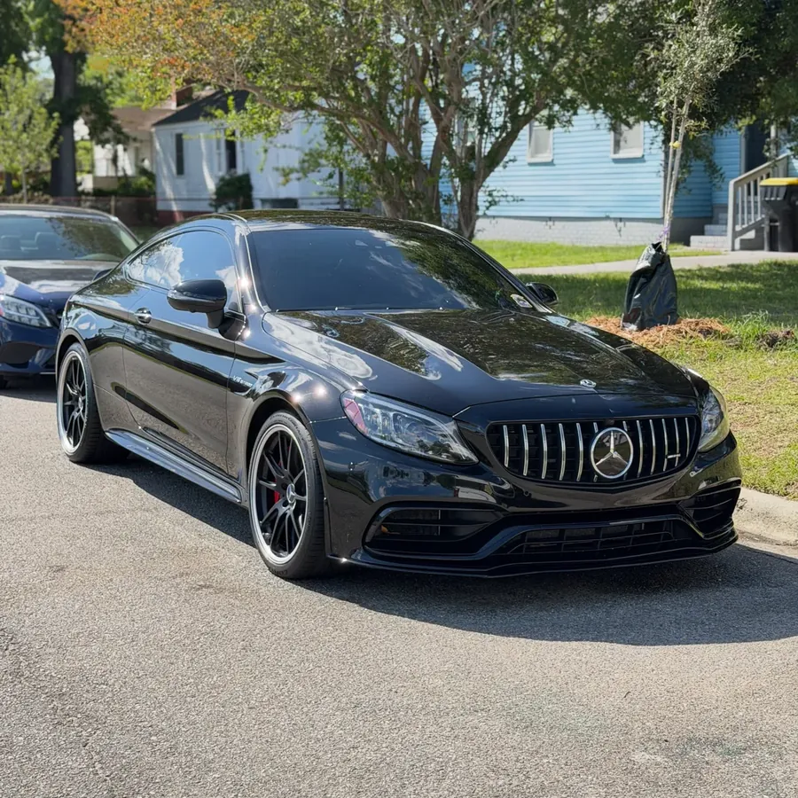 Black Mercedes-AMG coupe with a deep gloss finish